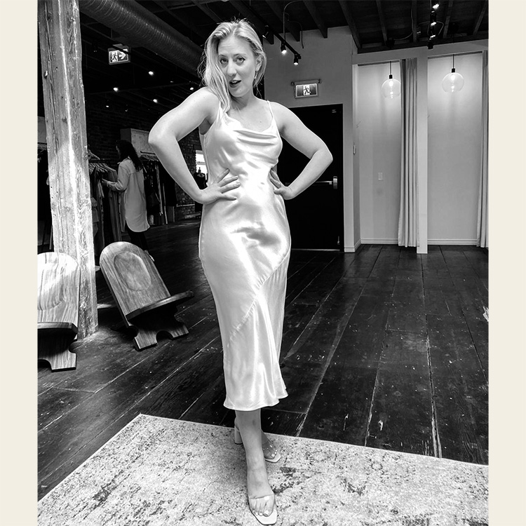 photo of a woman, casey, posing in a silky dress feeling fabulous